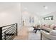 Upstairs sitting room area with vaulted ceilings, lots of natural light and minimalist decor at 863 S Race St, Denver, CO 80209