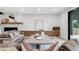 Well-lit living room with a fireplace, plush sofas, and modern decor at 863 S Race St, Denver, CO 80209