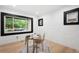Sunlit home office featuring bright brick walls, modern desk, and street view at 863 S Race St, Denver, CO 80209