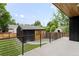 Backyard shed showcasing horizontal wood and black siding with a well-manicured lawn at 863 S Race St, Denver, CO 80209