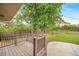 Backyard view from the deck, featuring a spacious lawn, fire pit and privacy fence at 8051 S Kendall Blvd, Littleton, CO 80128