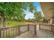 Landscaped backyard view from the deck, featuring a spacious lawn, fire pit and privacy fence at 8051 S Kendall Blvd, Littleton, CO 80128