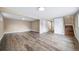 Finished basement featuring wood-look flooring and neutral paint at 8051 S Kendall Blvd, Littleton, CO 80128