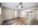 Bright bedroom with wood-look flooring, neutral paint and a ceiling fan at 8051 S Kendall Blvd, Littleton, CO 80128