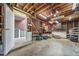 Spacious garage with ample storage, workbench, and natural light, offering a functional workspace at 8051 S Kendall Blvd, Littleton, CO 80128