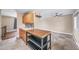 Open concept kitchen with large island and view to living room at 8051 S Kendall Blvd, Littleton, CO 80128