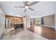 Open floor plan with kitchen with stainless steel appliances and bright living space with hardwood floors at 8051 S Kendall Blvd, Littleton, CO 80128