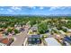 Community aerial view showcasing the home's location amid streets, trees, and mountain views at 550 S Raleigh St, Denver, CO 80219