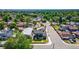 An aerial view of the property shows the neighborhood with a mix of houses and greenery at 550 S Raleigh St, Denver, CO 80219