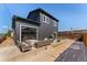 The home features a private fenced backyard, stylish furniture, and a fire pit at 550 S Raleigh St, Denver, CO 80219