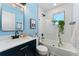 Bright bathroom features a tub and shower, vanity, and modern finishes at 550 S Raleigh St, Denver, CO 80219