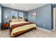 Comfortable bedroom with modern décor, ample natural light, and wood floors at 550 S Raleigh St, Denver, CO 80219