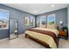 Relaxing bedroom with natural light, wood floors, and modern decor at 550 S Raleigh St, Denver, CO 80219