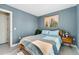 Relaxing bedroom with natural light, wood floors, and modern decor at 550 S Raleigh St, Denver, CO 80219