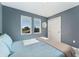 This bedroom boasts bright natural light, a closet, and neutral gray walls at 550 S Raleigh St, Denver, CO 80219