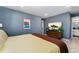 Comfortable bedroom with modern décor, ample natural light, and en-suite bathroom at 550 S Raleigh St, Denver, CO 80219