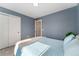 This bedroom features soft, natural lighting, a closet, and an ensuite at 550 S Raleigh St, Denver, CO 80219