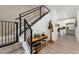 Inviting entryway features a modern staircase, wooden floors, and a shoe rack at 550 S Raleigh St, Denver, CO 80219