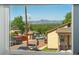Window view showcasing the neighborhood and mountains, creating a scenic backdrop at 550 S Raleigh St, Denver, CO 80219