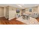 Finished basement with a colorful rug, a built-in bookshelf, and a comfortable seating area at 938 W Peakview Cir, Littleton, CO 80120