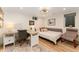 Inviting bedroom with a study desk, a trundle bed, and a decorative area rug at 938 W Peakview Cir, Littleton, CO 80120