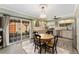 Cozy eat-in kitchen featuring a round table, sliding glass doors, and stainless steel appliances at 938 W Peakview Cir, Littleton, CO 80120