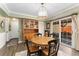 Eat-in kitchen features a round table, hardwood floors, and a built-in hutch at 938 W Peakview Cir, Littleton, CO 80120