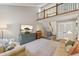 Spacious living area with high ceilings, comfortable furniture, and a staircase leading to upper level at 938 W Peakview Cir, Littleton, CO 80120