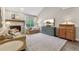 Cozy living room features a fireplace, plush seating, and a bright window for natural light at 938 W Peakview Cir, Littleton, CO 80120