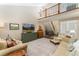 Spacious living room with soaring ceilings, large windows, and a comfortable seating arrangement at 938 W Peakview Cir, Littleton, CO 80120