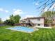 Spacious backyard with a deck perfect for outdoor entertaining and partially covered pool at 10536 Garrison St, Westminster, CO 80021