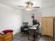 Bedroom featuring wood-look flooring, ceiling fan, desk, and ample workspace at 10536 Garrison St, Westminster, CO 80021