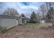 Backyard of the home featuring a shed and an enclosed patio area at 19326 E Greenwood Pl, Aurora, CO 80013