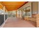 Covered porch with a table and chairs, wood flooring and railing at 19326 E Greenwood Pl, Aurora, CO 80013