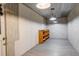 Inside the shed, the walls are white and there is a wooden shelf unit at 19326 E Greenwood Pl, Aurora, CO 80013