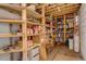 Interior of shed featuring wooden shelves with containers at 19326 E Greenwood Pl, Aurora, CO 80013