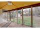 Sun room featuring carpet and windows with a view of the backyard at 19326 E Greenwood Pl, Aurora, CO 80013