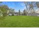 Green backyard with mature trees at 6900 S Clermont St, Centennial, CO 80122