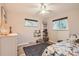 Cozy bedroom with ample natural light, dresser and bookshelf storage at 6900 S Clermont St, Centennial, CO 80122