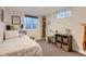 Inviting bedroom with a desk, bookshelf, and a window at 6900 S Clermont St, Centennial, CO 80122