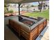 Covered patio with cozy seating area overlooking a spacious backyard at 6900 S Clermont St, Centennial, CO 80122