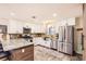 Spacious kitchen featuring stainless steel appliances, granite countertops, and modern white cabinetry at 6900 S Clermont St, Centennial, CO 80122