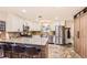 The open kitchen offers stainless steel appliances, granite countertops, and a stylish island at 6900 S Clermont St, Centennial, CO 80122