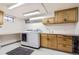Functional laundry room with modern appliances and storage cabinets at 6900 S Clermont St, Centennial, CO 80122