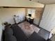 Cozy living room with a comfortable sofa, desk, and eclectic decor at 6900 S Clermont St, Centennial, CO 80122