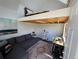 Bright loft featuring a bed nook, living space, and workspace with natural light at 6900 S Clermont St, Centennial, CO 80122