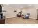 Finished basement area with carpet, cozy seating, and a reading nook with a floor lamp at 2558 Northview Pl, Castle Rock, CO 80104