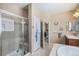 Bathroom showcasing a glass-enclosed shower, soaking tub, and vanity area at 2558 Northview Pl, Castle Rock, CO 80104