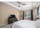 Serene bedroom with tray ceiling, large window, and neutral color scheme at 2558 Northview Pl, Castle Rock, CO 80104
