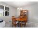 Light-filled dining room featuring wood table, chairs, and a classic china cabinet at 2558 Northview Pl, Castle Rock, CO 80104